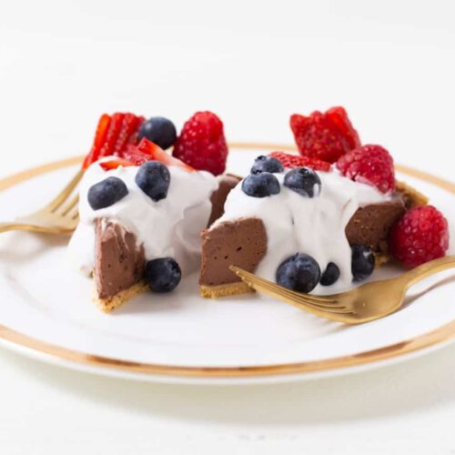 vegan chocolate pie with whipped cream and berries