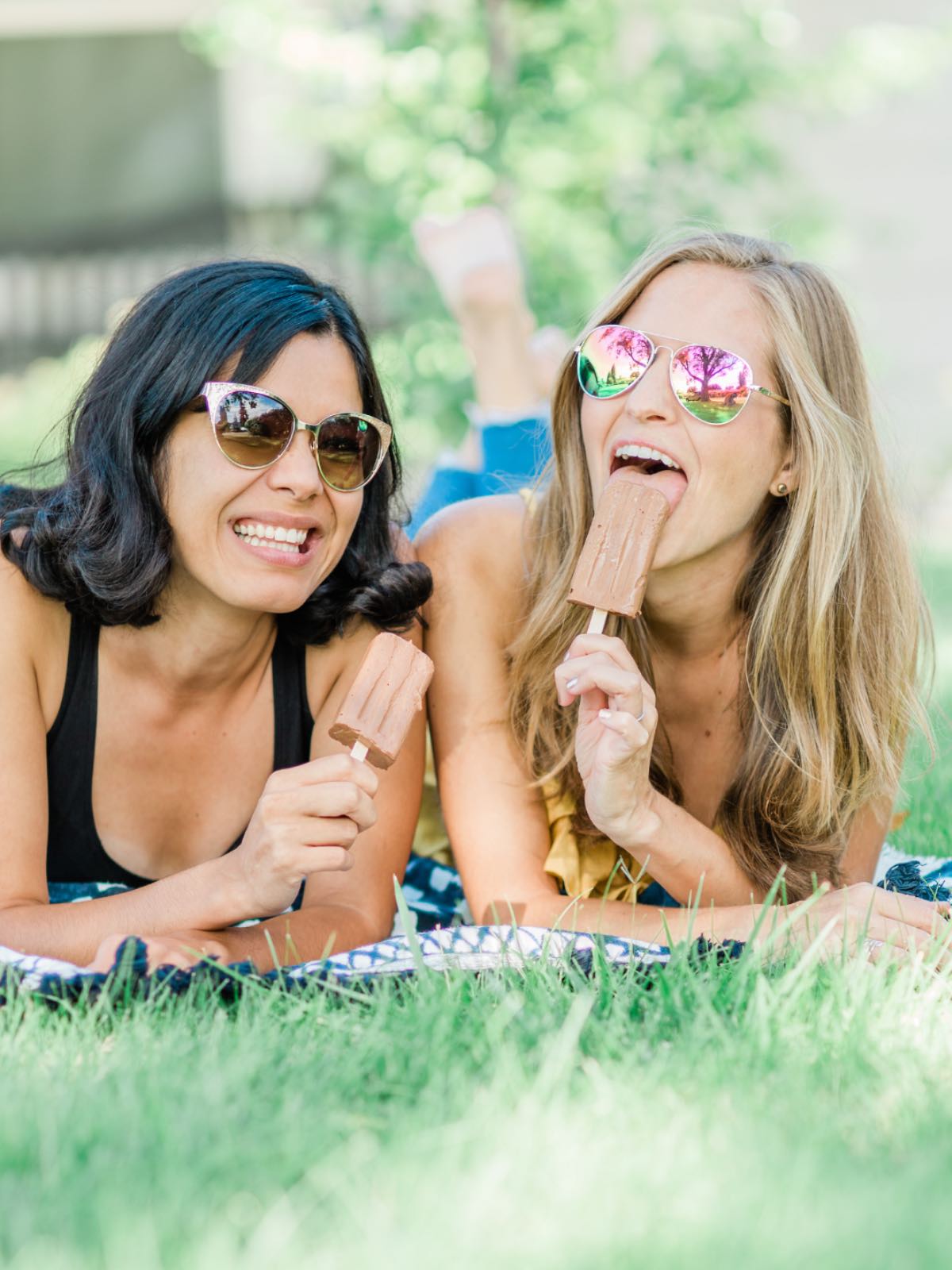 Vegan friends Michelle Cehn and Toni Okamoto enjoying homemade chocolate fudgesicles made from silken tofu pudding.