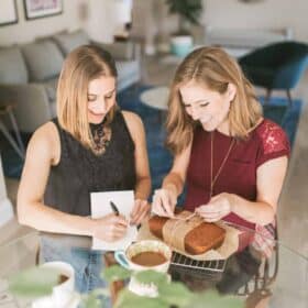 Michelle Cehn and Kristie Middleton Wrapping Homemade Pumpkin Bread and Writing Holiday Cards