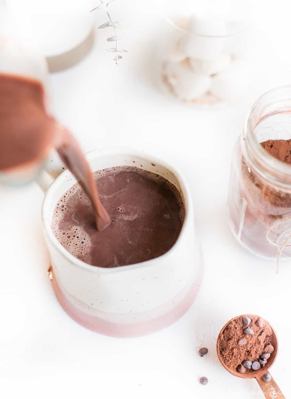 Pouring Vegan Hot Chocolate into a Mug