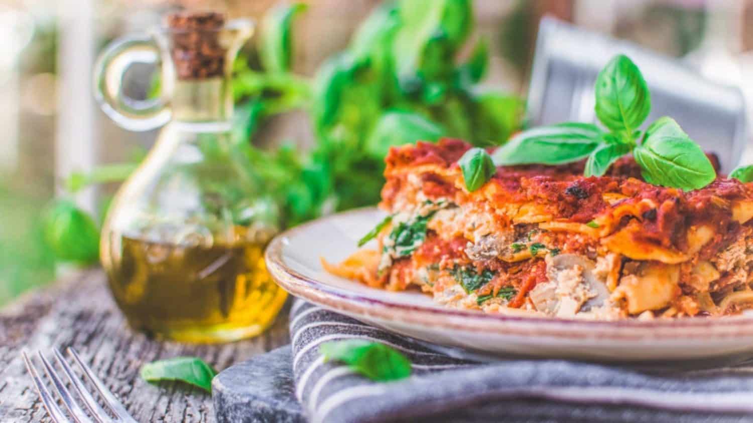 Vegan Lasagna With Tofu Ricotta on a plate topped with basil