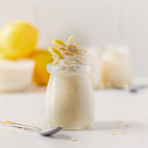 vegan lemon custard curd in a ramekin with fresh meyer lemons