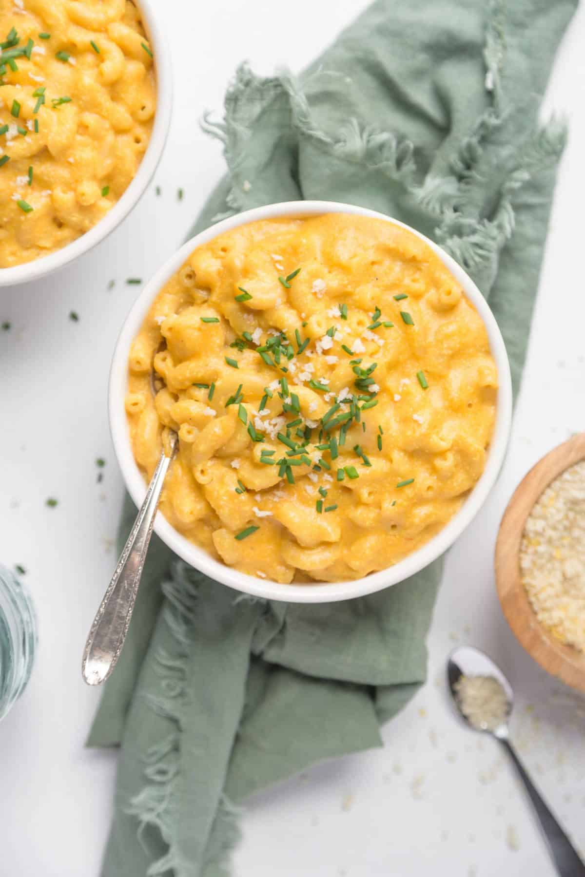 A top-down shot of vegan mac and cheese in a white bowl.