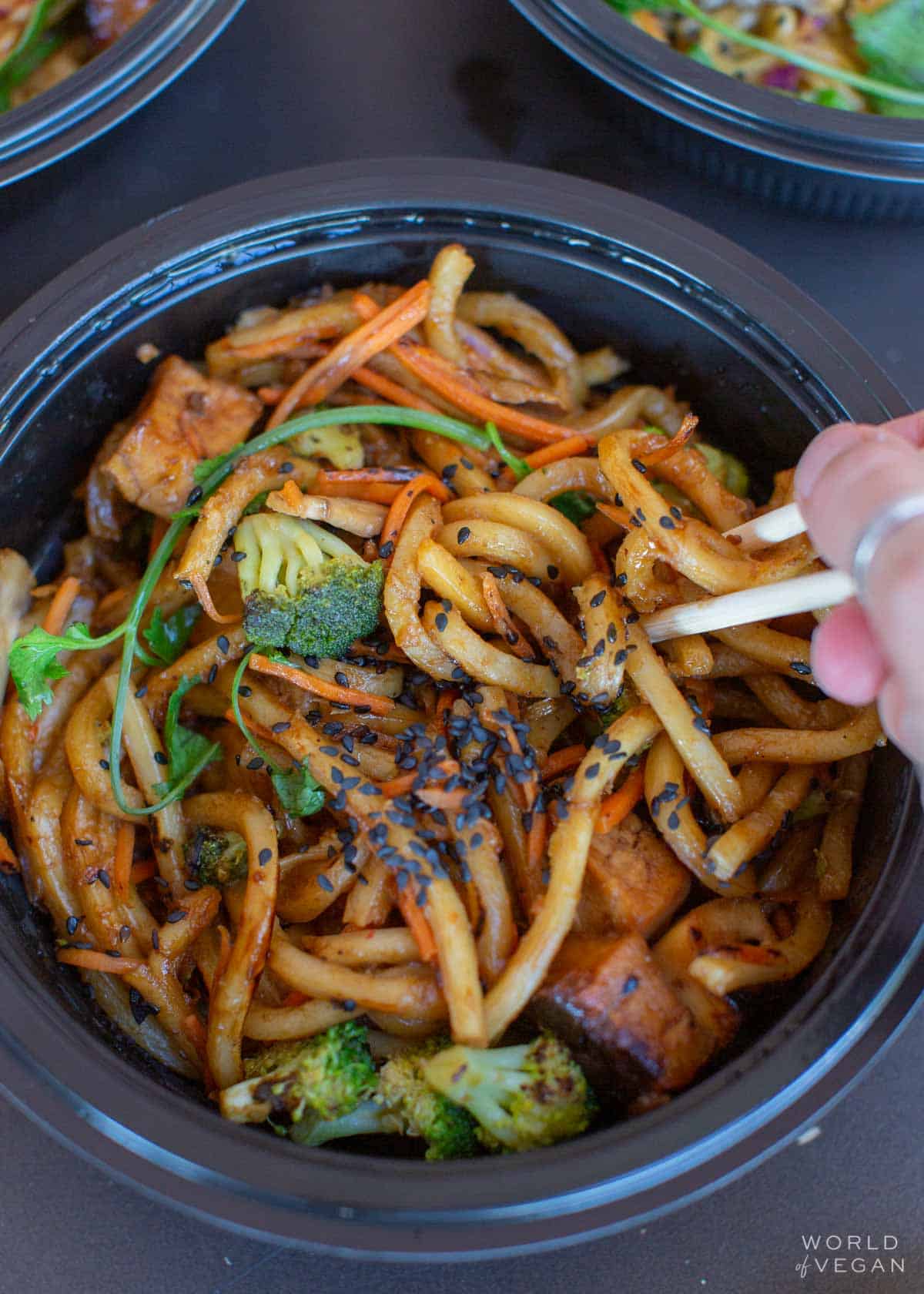 Take out container of vegan Japanese pan noodles and company