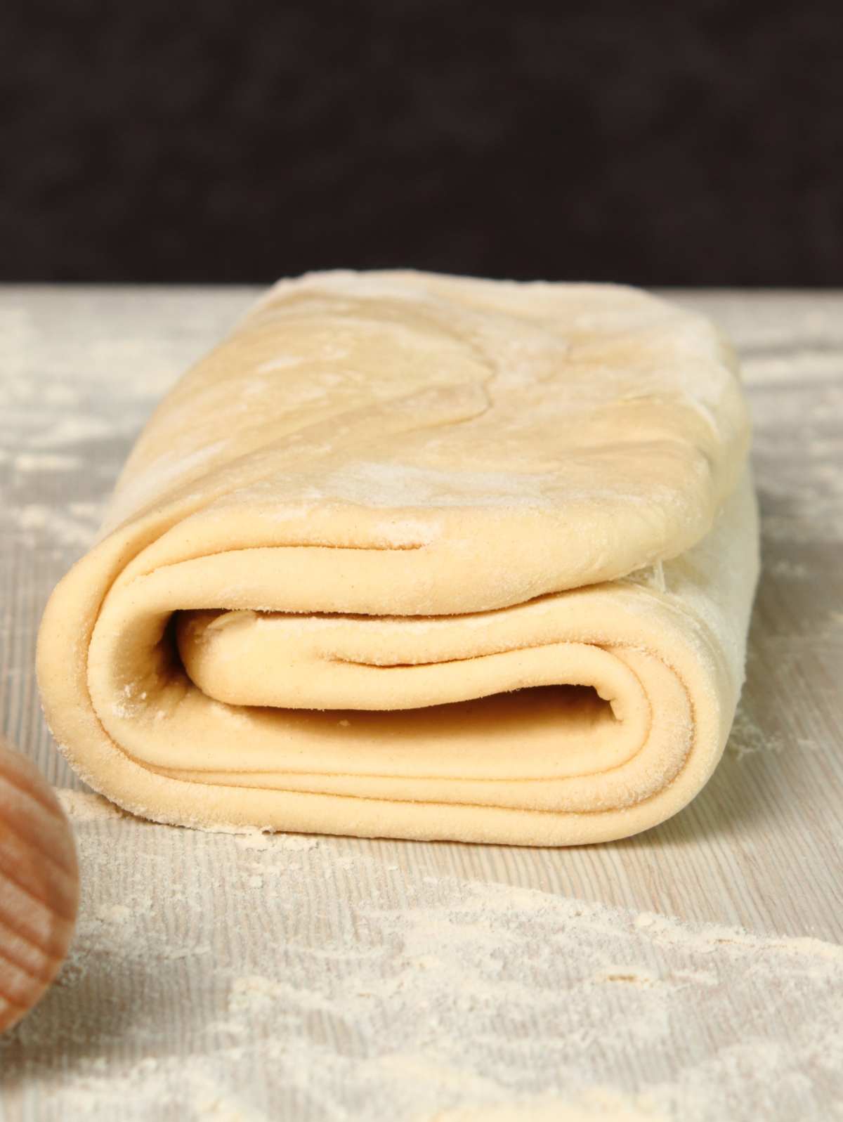 Vegan puff pastry folded into thirds like a letter.