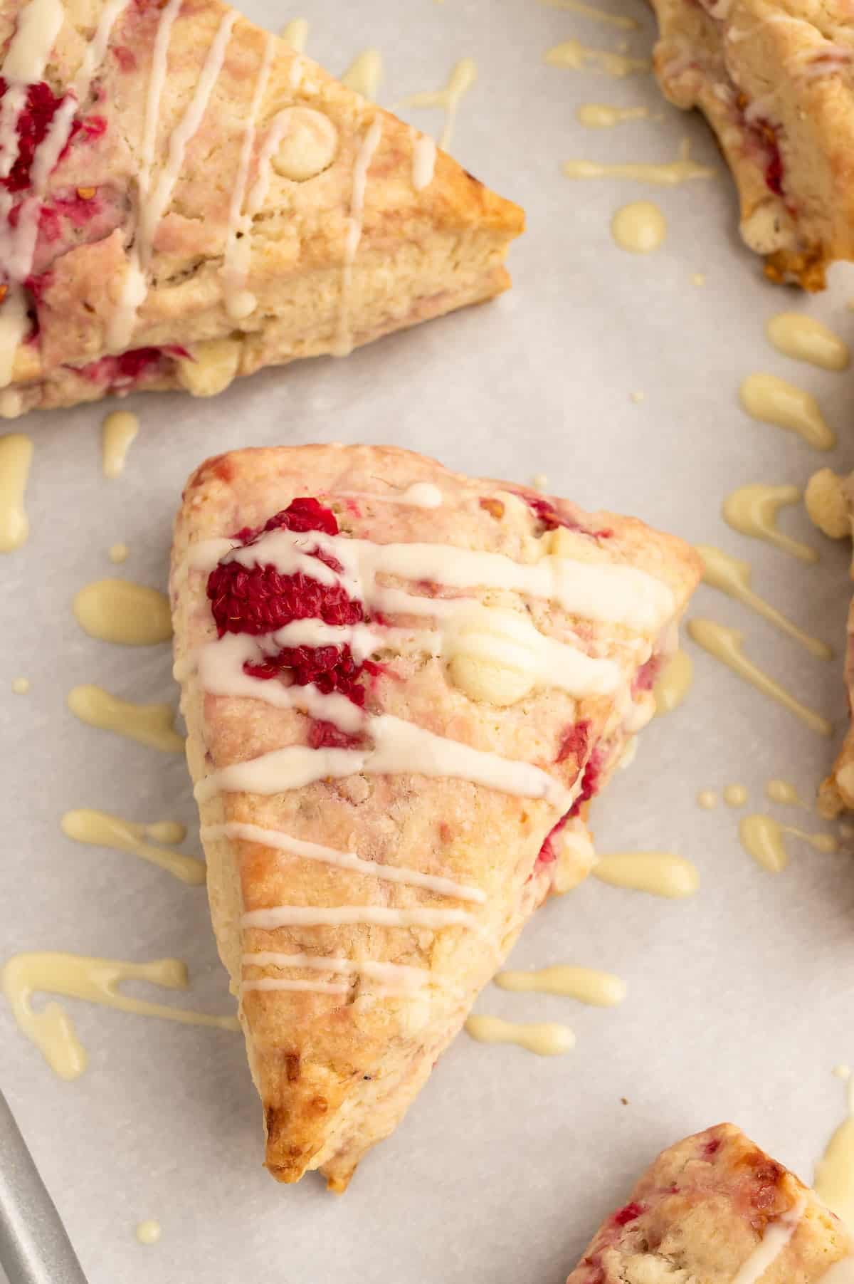 A vegan scone drizzled with vegan white chocolate.