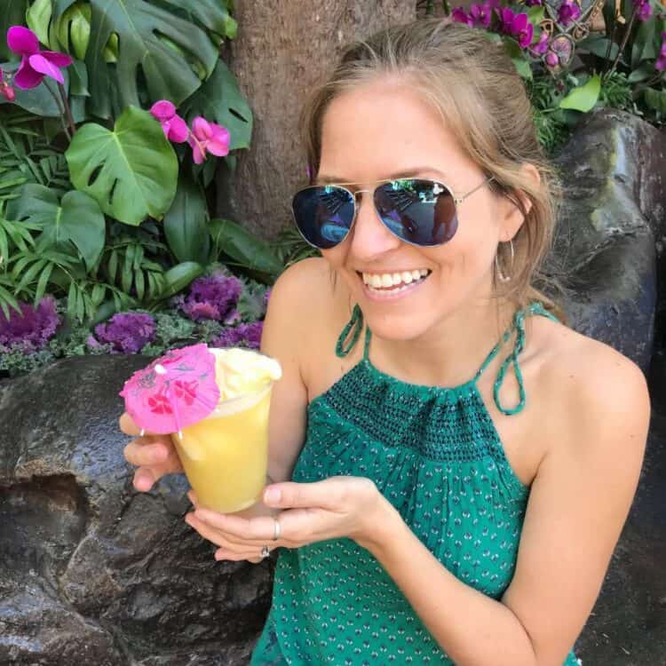 Michelle Cehn with vegan dole whip at Disneyland vegan travel destination.