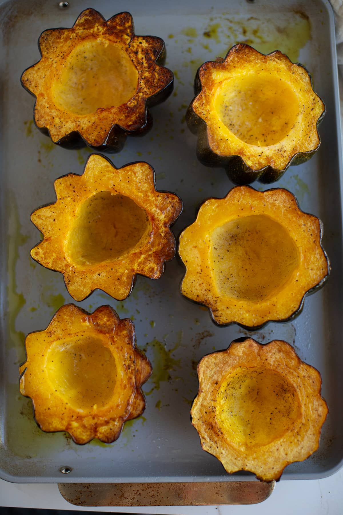 Baked acorn squash halves.