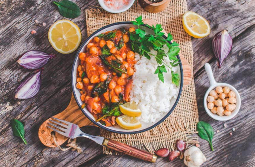 Vegan chickpea Stew Served on a Dish with Ingredients around