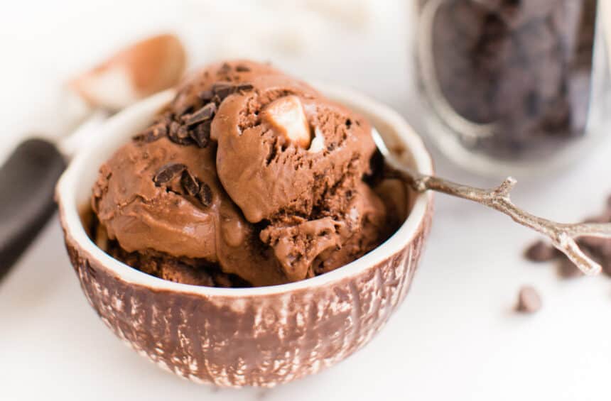 Vegan Rocky Road Ice Cream scooped into a bowl with dairy free chocolate and vegan marshmallows.